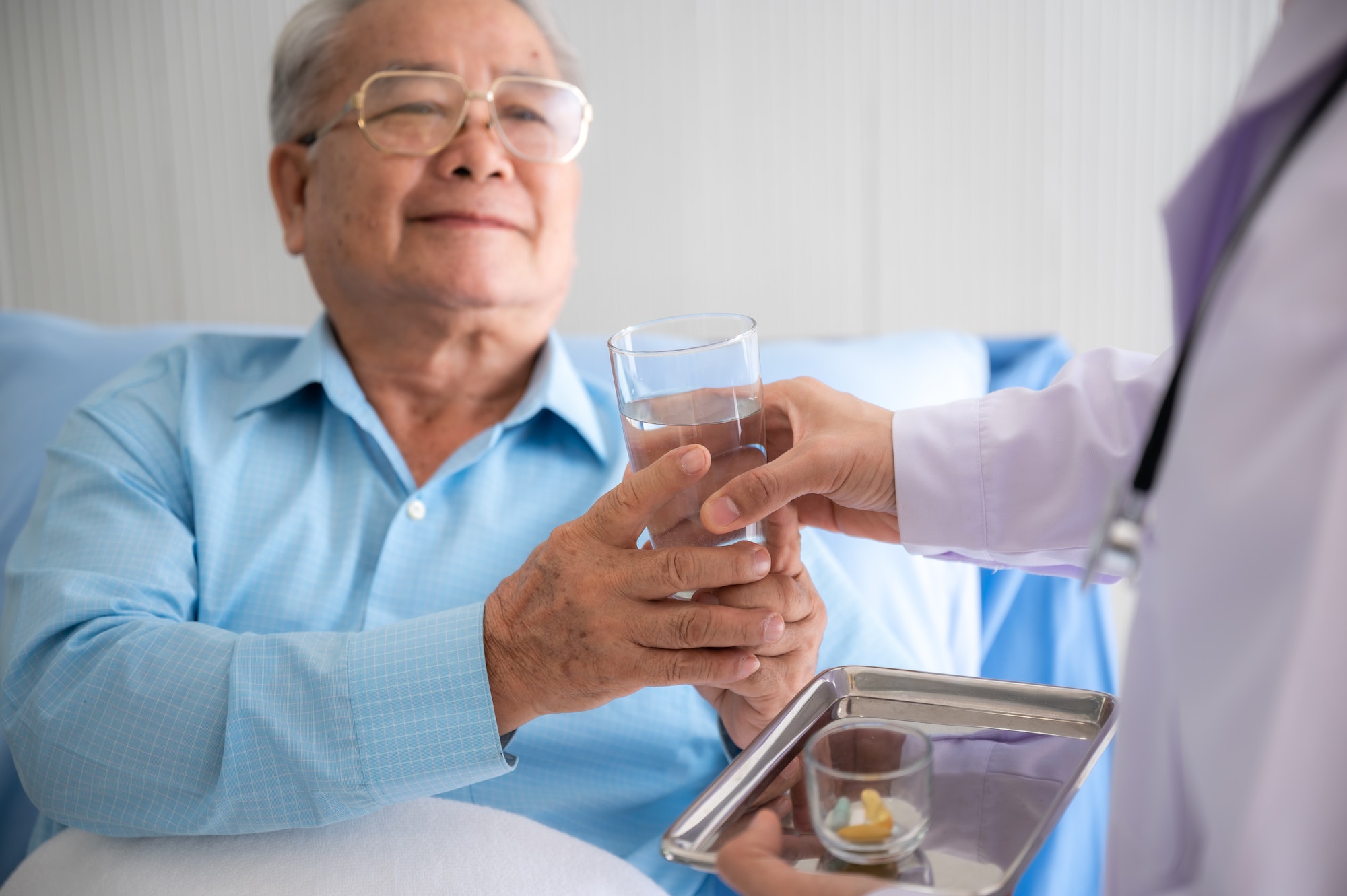 elderly patient old man in concept of health insurance, visit professional doctor at hospital